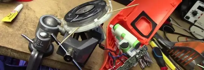 Vacuum cleaner repair parts and tools on a workbench in Gilbert, AZ